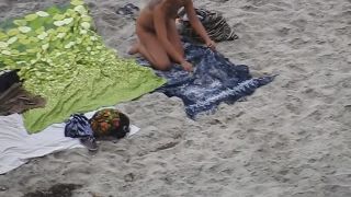 Nude beach, amateur girl shows tits and pussy-9