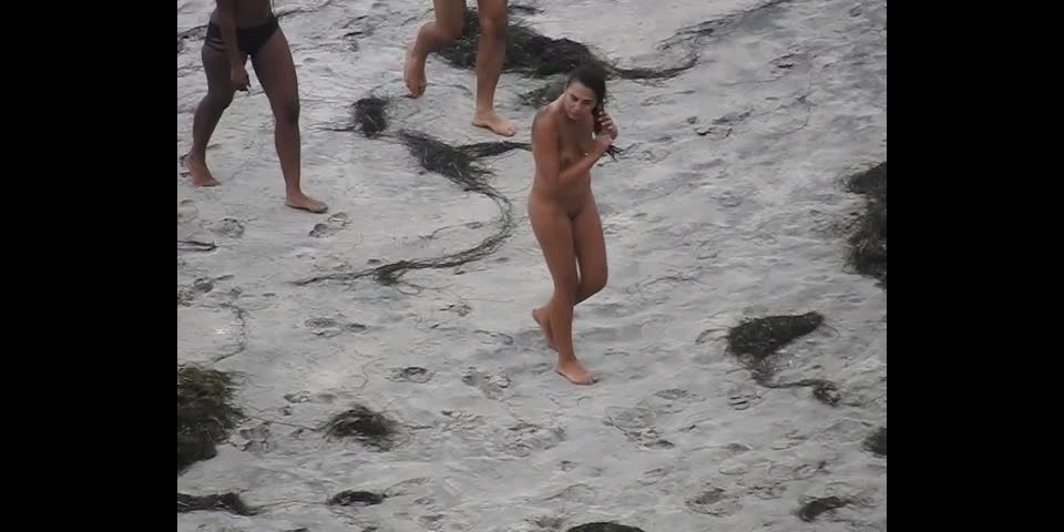 Nude beach, amateur girl shows tits and pussy