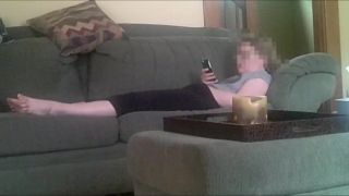 Horny girlfriend fingering pussy while watching phone porn on the couch. spy cam - Amateur-9