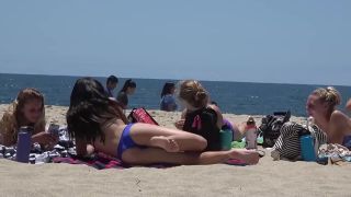 Perky little ass in front of me on beach-7