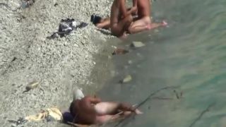 Two couples enjoying sex on a beach-1