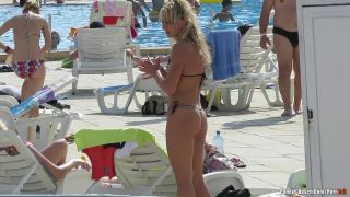 Sexy bikini milfs tanning at the pool!-2