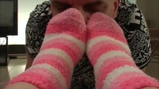 Foot Mistress makes her foot slave sniff her socks and lick her feet.-1