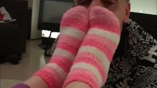 Foot Mistress makes her foot slave sniff her socks and lick her feet.-2
