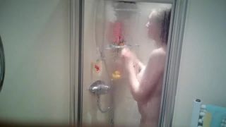 cute busty blonde girl taking a shower and shaving legs. hidden cam-6