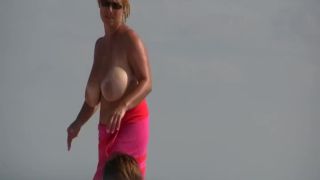 Gigantic mature tits on a beach Nudism-5