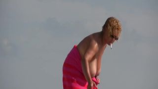 Gigantic mature tits on a beach Nudism-8