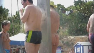 Naked woman with tattoos at beach  shower-4