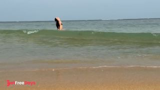 A girl in a bikini is swimming in the sea. Do you want to be my guide-0