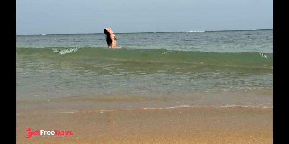 A girl in a bikini is swimming in the sea. Do you want to be my guide