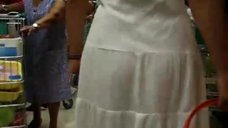 Thong peeks through her white  dress-2