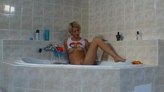 Alena plays with a sex toy in the  bath-7