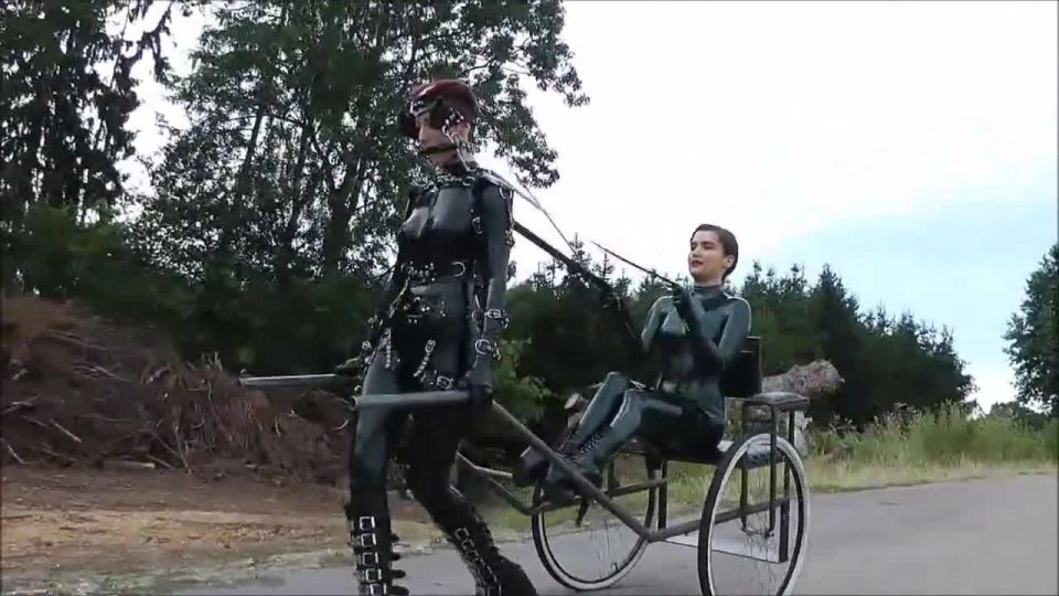 online porn clip 44 Latex Pony Outdoor. Female latex pony slave outdoor dominated by her Mistress using her whip to guide her in pulling a cart so that her owner can have fun being carried in this way, lady iveta femdom on fetish porn 