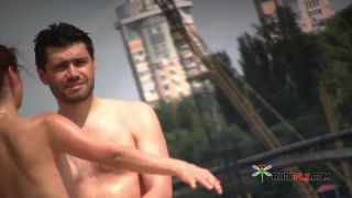 Watch this young nudist play nude in the warm sand  2-0