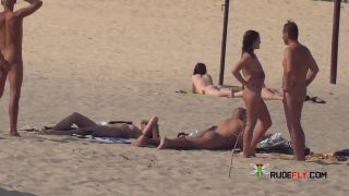 Slim girl with perky boobs naked at a nudist beach  3-0