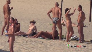 Slim girl with perky boobs naked at a nudist beach  3-6