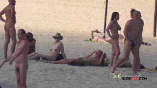 Slim girl with perky boobs naked at a nudist beach  3-8