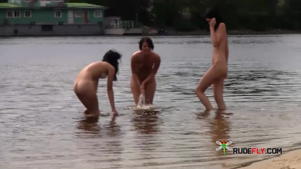 Nudist girl flashing at  beach