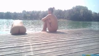 Nude women sunbathing by the lake-3