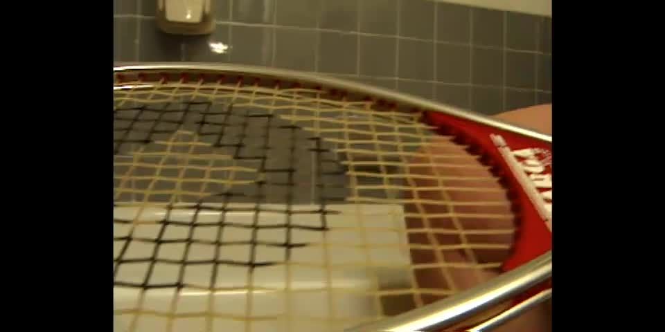 Delena brings a racket into the  bathroom