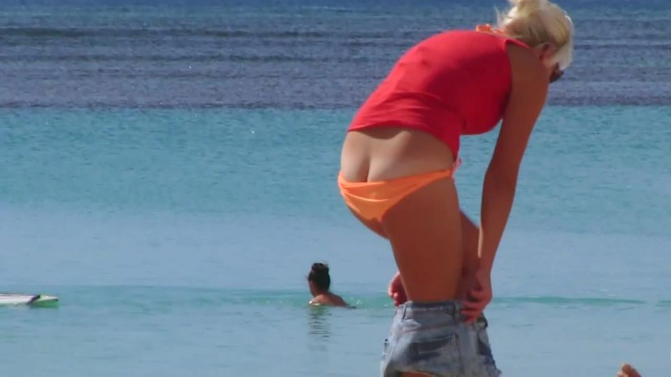 Milf's bikini malfunction on beach