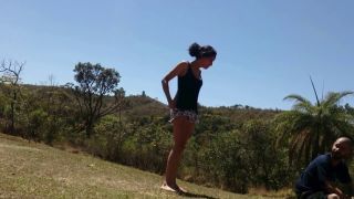 Cute and laughing petite but strong girl takes her guy outdoors in different locations and kicks his balls at each location. (Amateur porn)-2