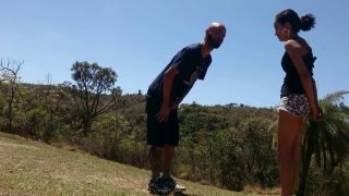 Cute and laughing petite but strong girl takes her guy outdoors in different locations and kicks his balls at each location. (Amateur porn)-6