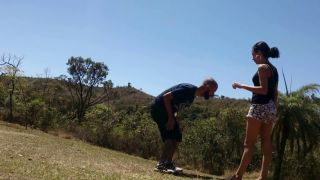 Cute and laughing petite but strong girl takes her guy outdoors in different locations and kicks his balls at each location. (Amateur porn)-9