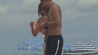 Topless milf gives back rub on beach-7