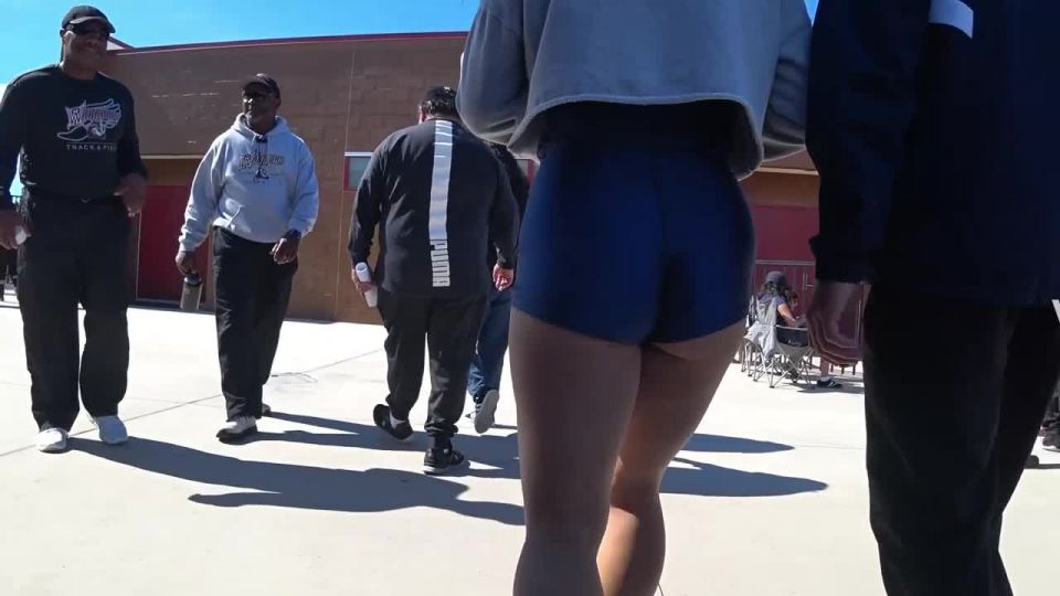 Thick thighs and ass in glowing blue shorts Voyeur!