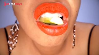 Ebony MILF with red lips eats a fruit suggestively-0