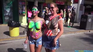 Busty gals showing painted tits-1