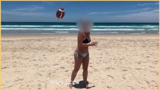 WifeyDoesWife gets her perfect tits out at the beach in her bikini-0