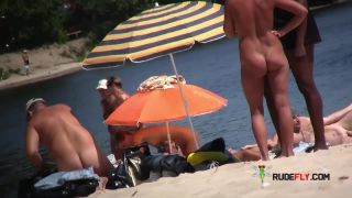 Watch these smooth nudists play at a public beach  3-0